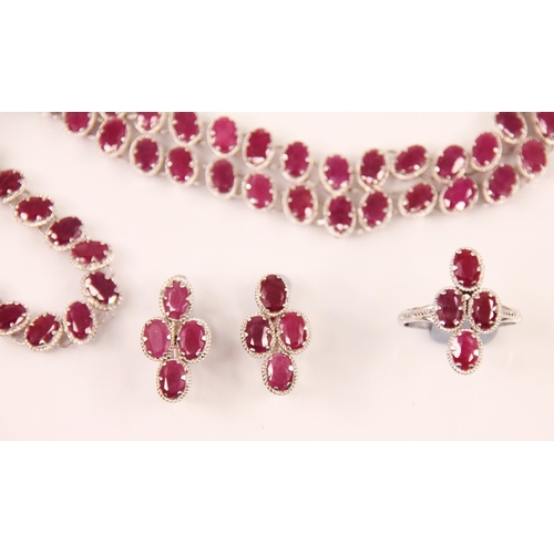 189 - A suite of ruby set jewellery, comprising an oval cut ruby necklace with matched bracelet, a pair of... 