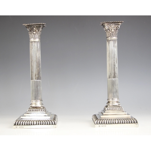 2 - A pair of Victorian silver candlesticks, Goldsmiths & Silversmiths Co, London 1894, the weighted ste... 