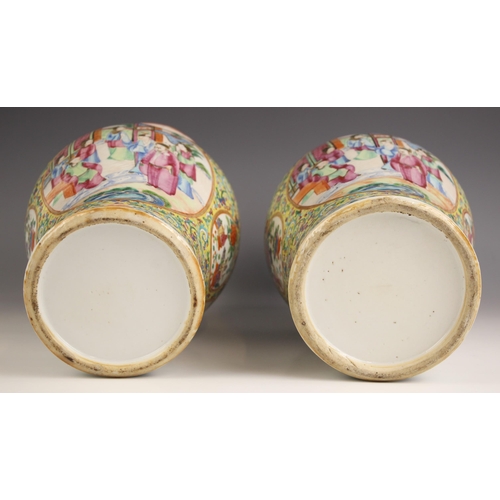 342 - A pair of Chinese porcelain famille rose vases, Canton (19th century), the baluster shaped vases ext... 