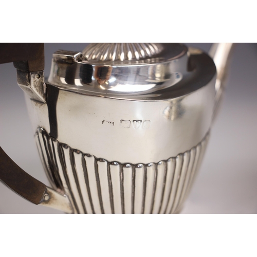 51 - An Edwardian silver pedestal sugar bowl, Chester 1908, the flared rim above bulbous body upon pedest... 