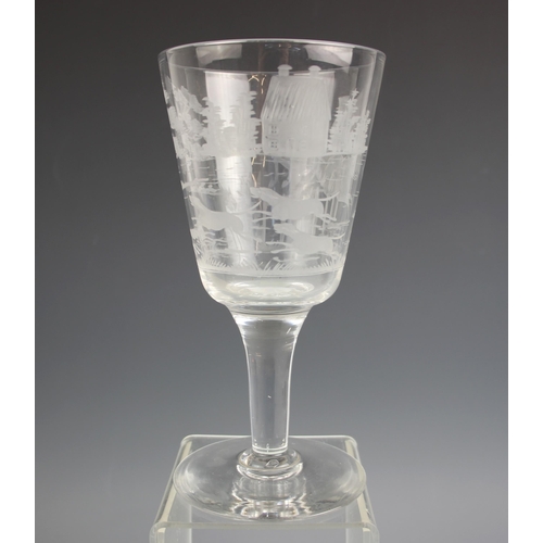 516 - A glass chalice, early 20th century, the funnel bowl wheel cut with continuous hunting scene, on tap... 