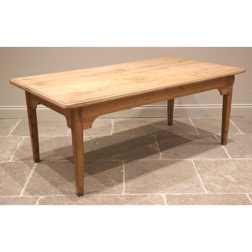 761 - A pine scrub top kitchen/scullery table, 19th century and later, the rectangular plank top with a mo... 