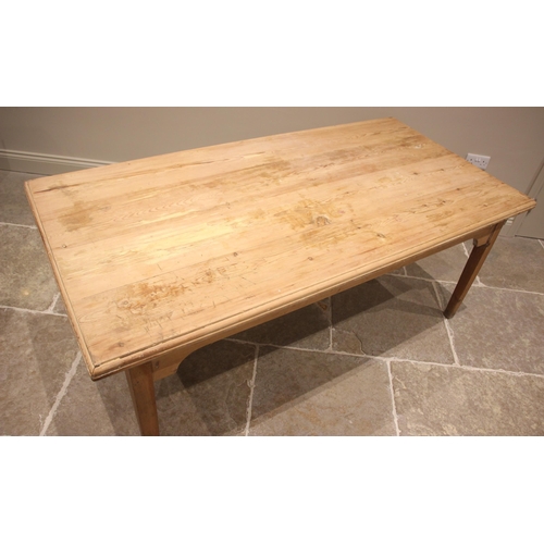 761 - A pine scrub top kitchen/scullery table, 19th century and later, the rectangular plank top with a mo... 