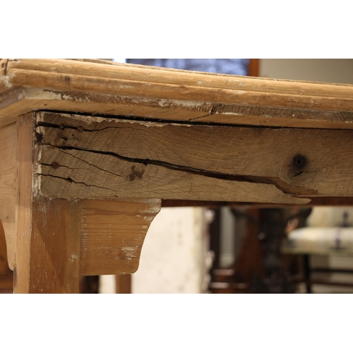 761 - A pine scrub top kitchen/scullery table, 19th century and later, the rectangular plank top with a mo... 