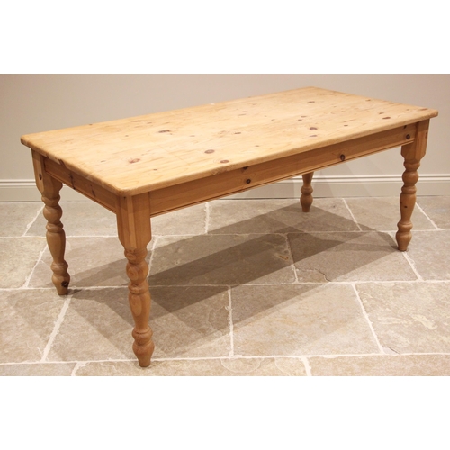 765 - A Victorian style pine kitchen table, late 20th century, the rectangular top with rounded corners, u... 