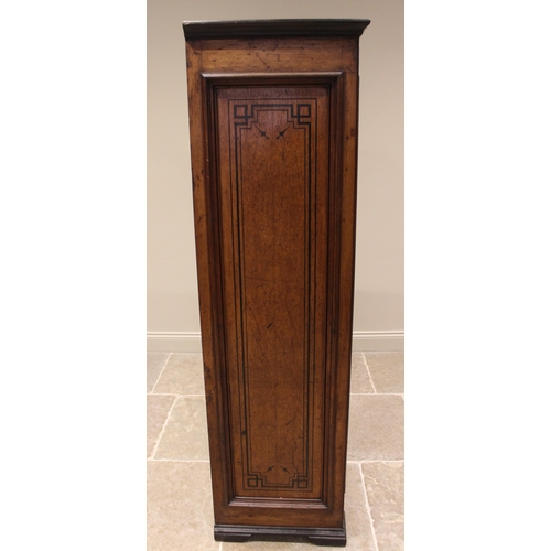 769 - An Aesthetic Movement honey oak hall cupboard, late 19th century, the moulded and ebonised cornice o... 