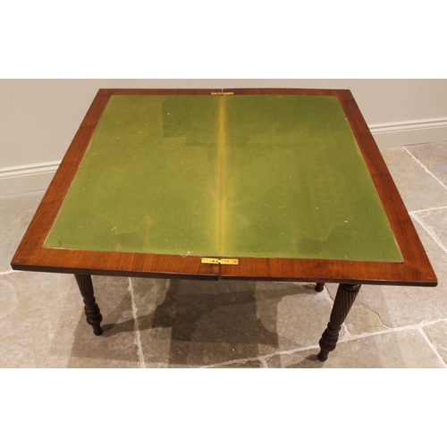 770 - A walnut fold over games table, late 19th/early 20th century, the hinged rectangular moulded top con... 