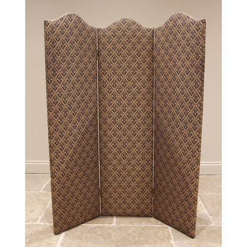 778 - A glazed walnut three fold screen, late 19th/early 20th century, each section with a 'C' scroll cres... 