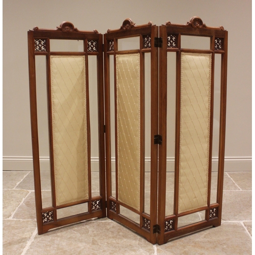 778 - A glazed walnut three fold screen, late 19th/early 20th century, each section with a 'C' scroll cres... 