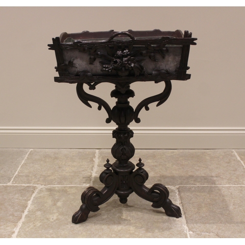 781 - A Black Forest carved jardinere/plant stand, probably linden wood, late 19th/early 20th century, the... 