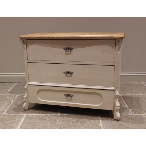 794 - A painted pine commode/chest of drawers, late 20th century, the serpentine top over three long drawe... 