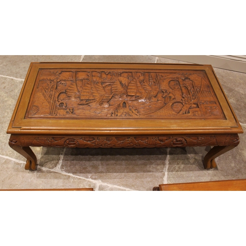 799 - A Chinese carved hardwood coffee table, late 20th century, the top carved in deep relief depicting a... 