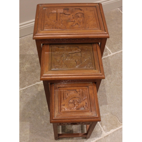 799 - A Chinese carved hardwood coffee table, late 20th century, the top carved in deep relief depicting a... 