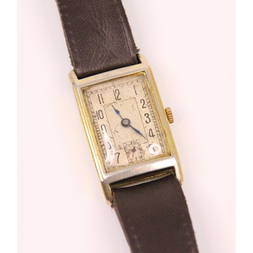 82 - An Art Deco rectangular faced wrist watch, the silver coloured rectangular dial with Arabic numerals... 