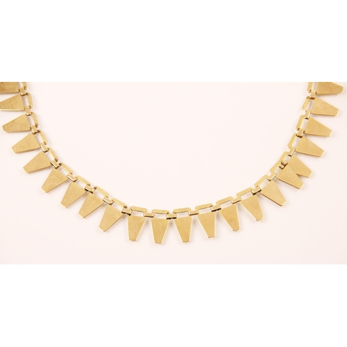 132 - A yellow metal fringe necklace, the necklace designed as forty five openwork tapered links, with bol... 