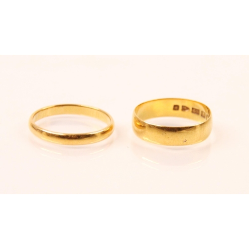 134 - A 22ct yellow gold wedding band, stamped 'WWLd' Birmingham 1953, ring size N 1/2, with a further 22c... 