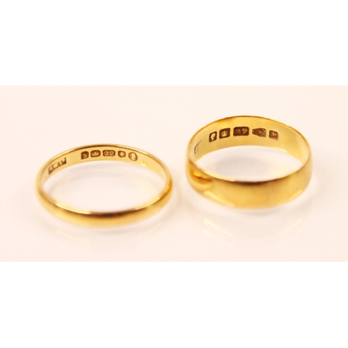 134 - A 22ct yellow gold wedding band, stamped 'WWLd' Birmingham 1953, ring size N 1/2, with a further 22c... 