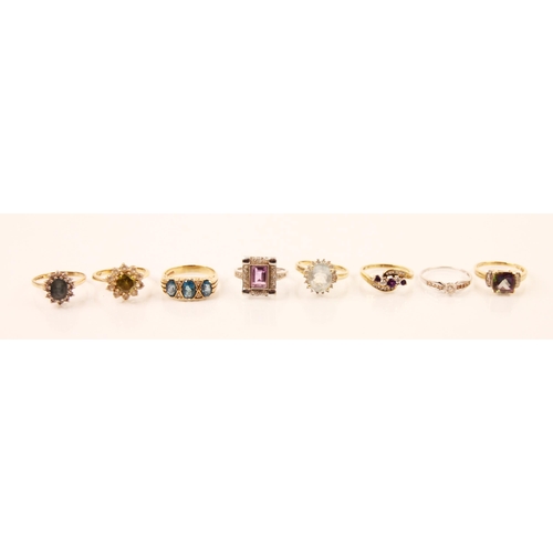 141 - A selection of diamond and paste rings, including a graduated blue stone ring within a carved yellow... 