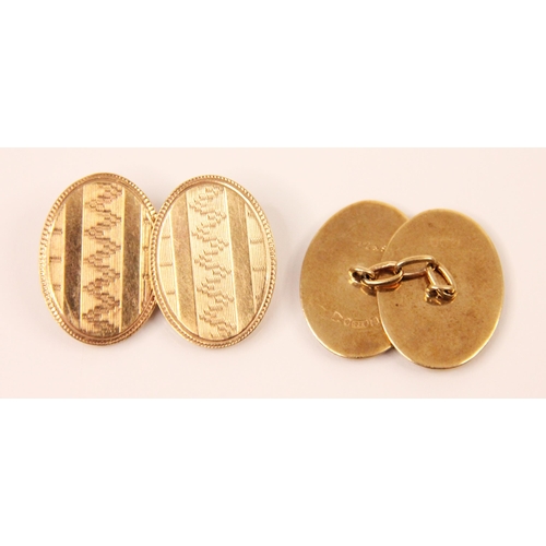 168 - A pair of 9ct yellow gold cufflinks, the oval links with engraved and engine turned detail, with tra... 