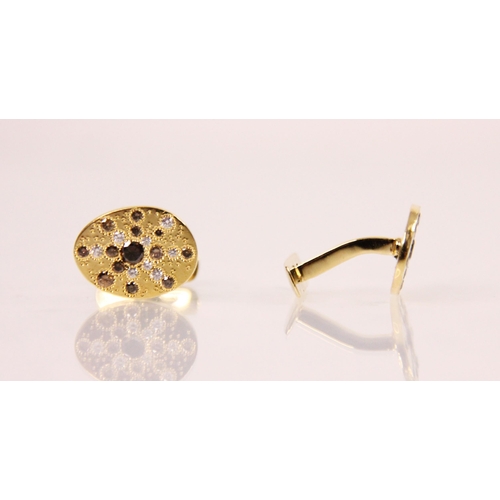 191 - A pair of De Beers 'Talisman' diamond cufflinks, the oval shaped yellow metal cufflinks with central... 