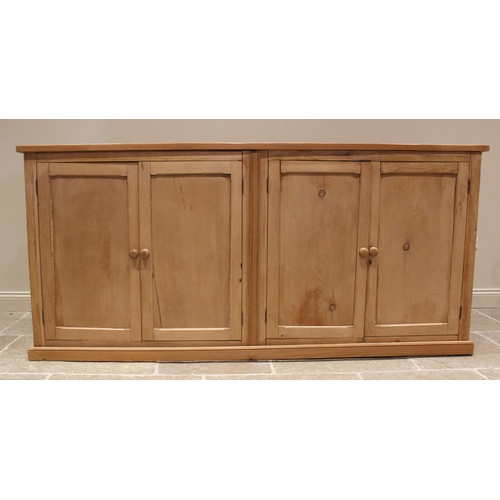 773 - A Victorian and later stripped pine scullery/kitchen cupboard, the later plank top over two pairs of... 