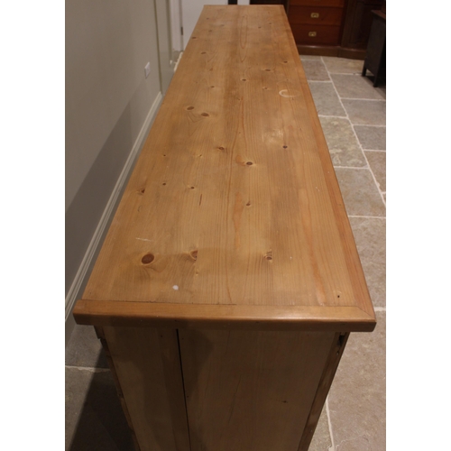 773 - A Victorian and later stripped pine scullery/kitchen cupboard, the later plank top over two pairs of... 