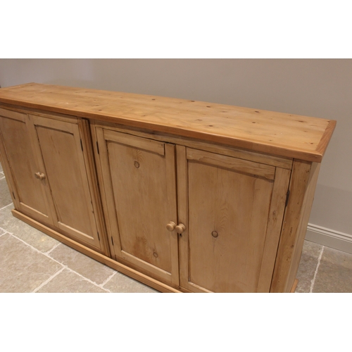 773 - A Victorian and later stripped pine scullery/kitchen cupboard, the later plank top over two pairs of... 