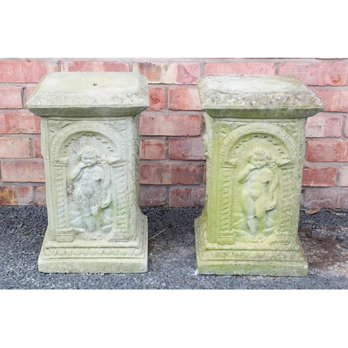 805 - A pair of reconstituted stone garden pedestals, each of square section, cast in relief with arcaded ... 