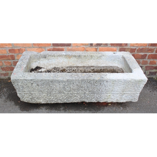 816 - An 18th/19th century granite trough, of rectangular form, with drain hole to the interior, scored ve... 