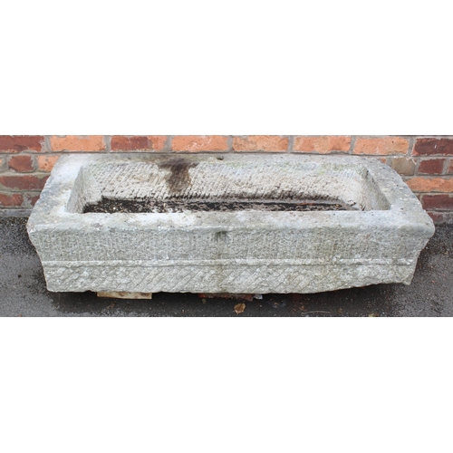 817 - An 18th/19th century granite trough, of rectangular form, with drain hole to the interior, scored ve... 