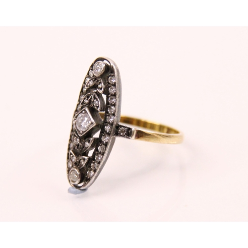 94 - An Edwardian style diamond ring, the central round cut diamond with diamond set leaf and white metal... 