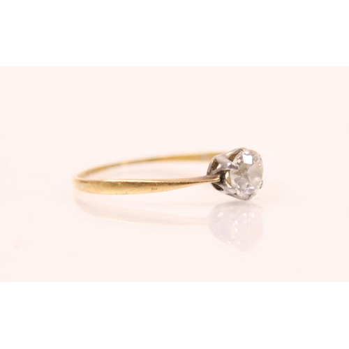 95 - An Edwardian diamond solitaire ring, the old cut diamond in white metal six claw setting, leading to... 