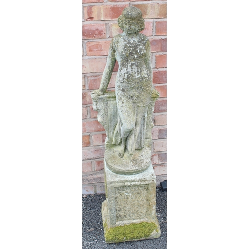 802 - A reconstituted stone garden ornament, modelled as a classical female figure, upon a plinth base, 11... 