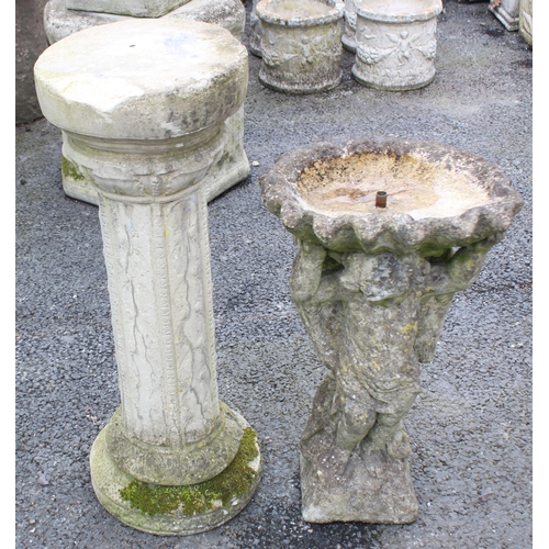 807 - A reconstituted stone figural bird bath / water feature, the shallow well modelled as a clam shell u... 