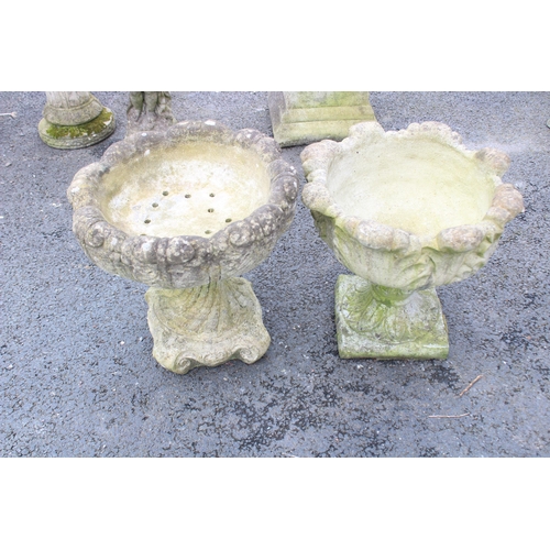 808 - A matched pair of reconstituted stone planters, each of acanthus urn form, 46cm and 44cm high (2)