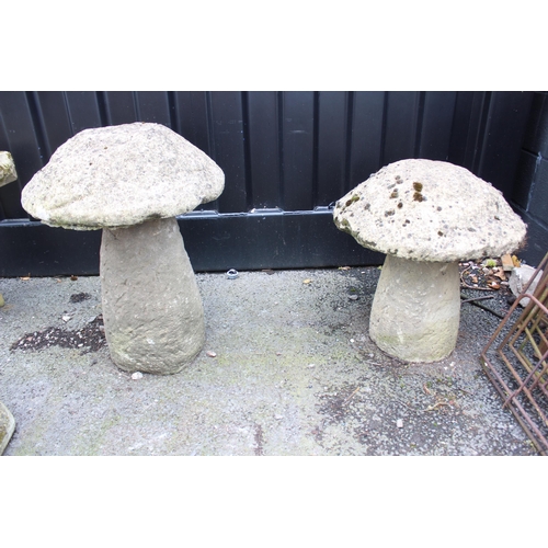 829 - Two sandstone staddlestones, of mushroom form, 53cm H x 50cm D and 66cm H x 50cm D (2)