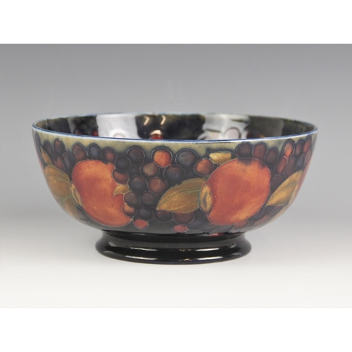 422 - A Moorcroft footed bowl in the Pomegranate pattern, early 20th century, full William Moorcroft signa... 