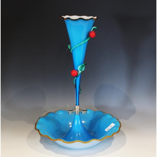 487 - A vibrant blue opaque glass epergne, with a central trumpet over two smaller trumpets, each with fla... 