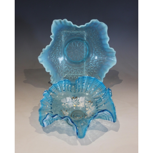 488 - A blue glass bowl with shaped vaseline rim and prunted roundels, 22cm diameter, with two  smaller si... 