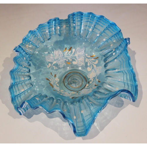 488 - A blue glass bowl with shaped vaseline rim and prunted roundels, 22cm diameter, with two  smaller si... 