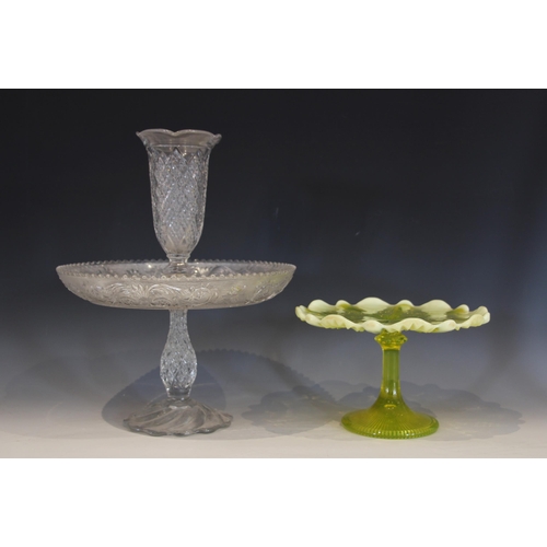 489 - A citrus green glass cake stand, with ribbed platter and opaque shaped rim, 15cm high, with a clear ... 