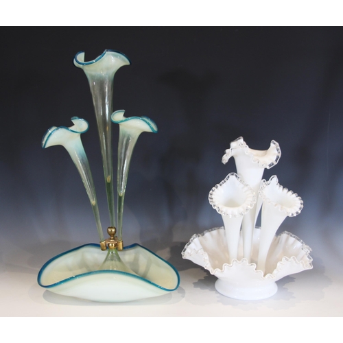 490 - A milk glass epergne, with a central trumpet over three smaller trumpets, all with crimped clear gla... 