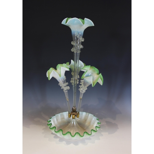 490 - A milk glass epergne, with a central trumpet over three smaller trumpets, all with crimped clear gla... 