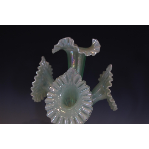 492 - A Fenton pale green iridescent glass epergne, with central trumpet over three smaller trumpets, each... 