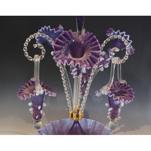 500 - An amethyst glass epergne of typical form, with central trumpet over three lower trumpets, and three... 