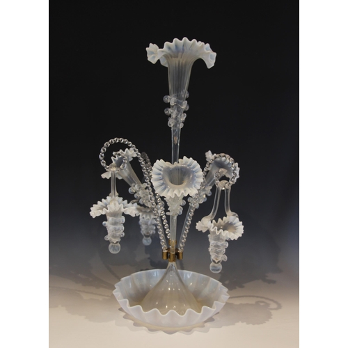 503 - A white and clear glass epergne of typical form, with central trumpet over three lower trumpets, and... 