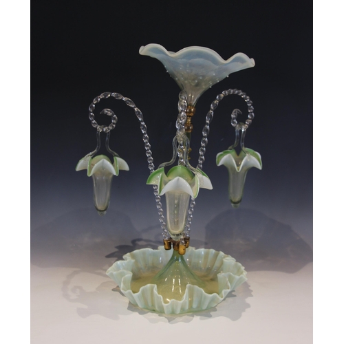 505 - A vaseline glass epergne, with a central trumpet over three lower canes supporting hanging baskets, ... 