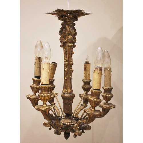 528 - A French gilt metal six branch chandelier, early 20th century, the central upright cast with fruit a... 