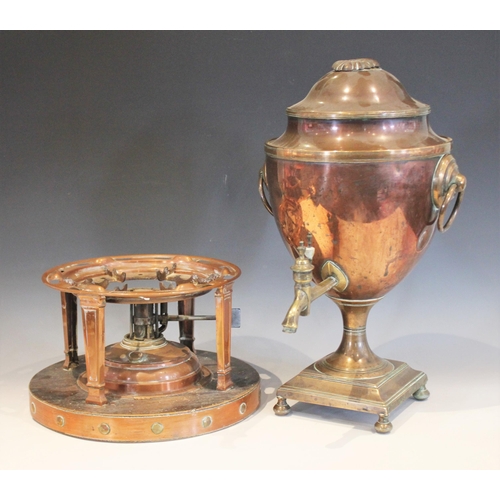 541 - A Regency copper samovar of urn form, applied with side ring handles upon a integral plinth base (at... 