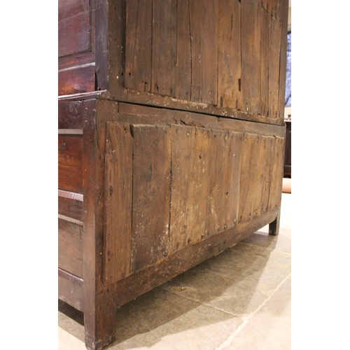 712 - A late 18th century oak jointed livery cupboard, probably Welsh, the moulded cornice above a frieze ... 